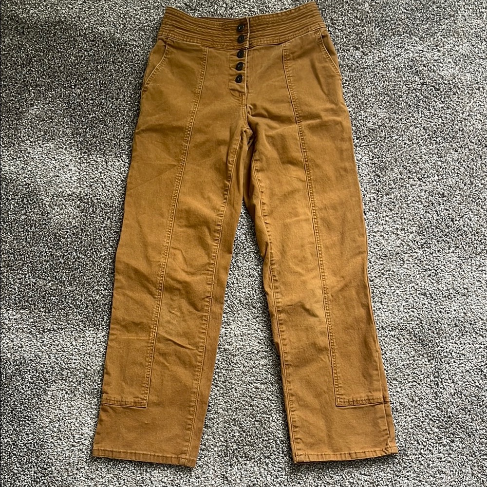Tan/brownish Chelsea and violet pants